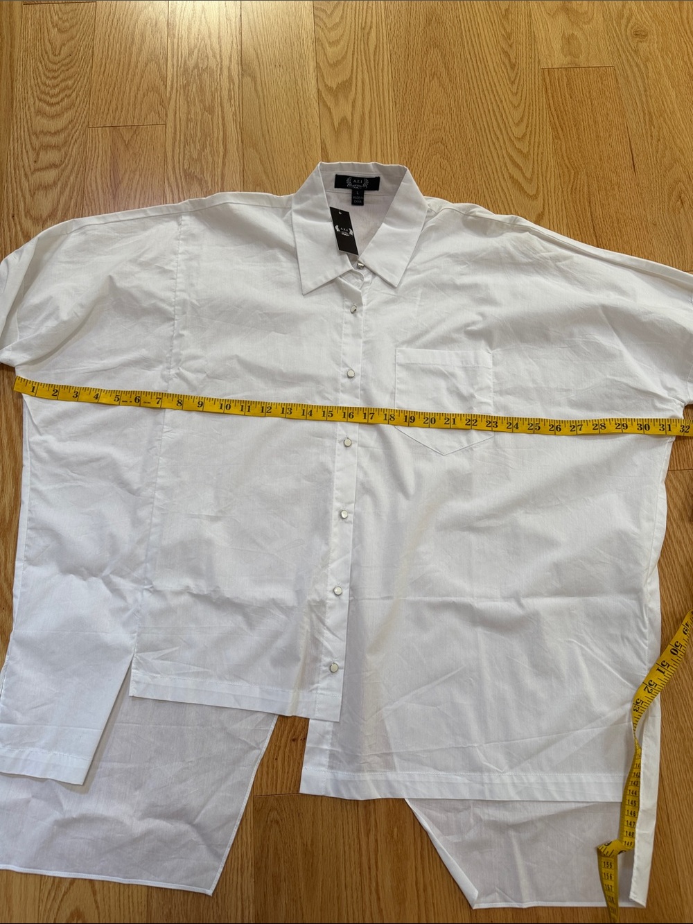 New! A.Z.I white large asymmetrical back crossover top. - Picture 9 of 10